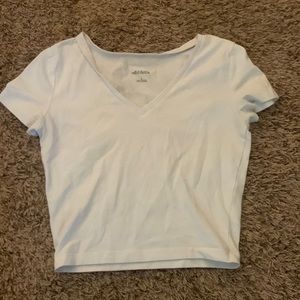 white v neck cropped shirt